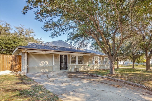 ranch-style house featuring a garage