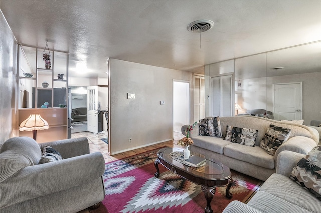 living room with light tile patterned floors