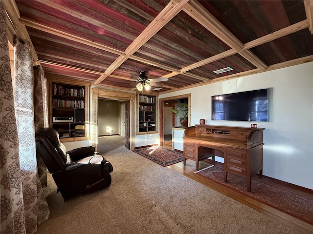 living room with carpet, built in shelves, ceiling fan, wooden ceiling, and coffered ceiling