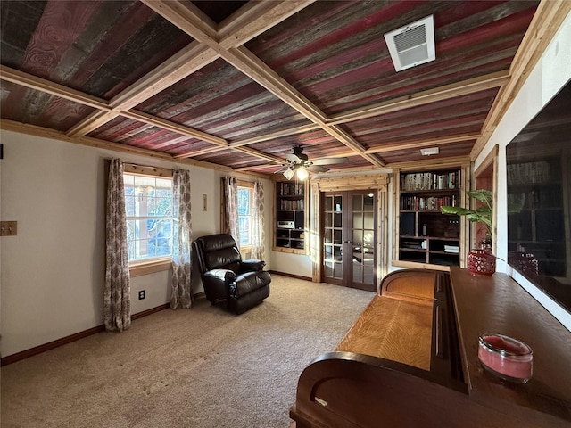 sitting room featuring french doors, ceiling fan, light carpet, and coffered ceiling