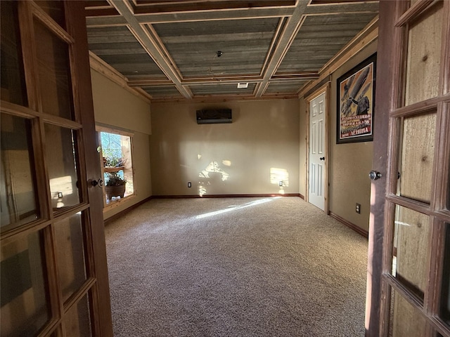 carpeted empty room featuring wood ceiling and coffered ceiling