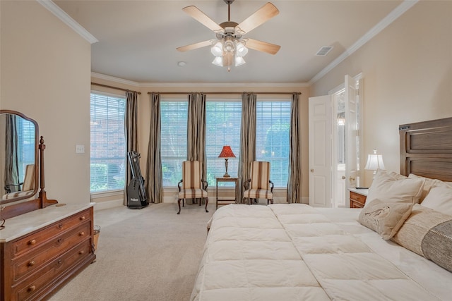 bedroom with ceiling fan, ornamental molding, and light carpet