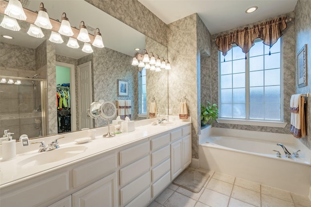 bathroom with separate shower and tub and vanity