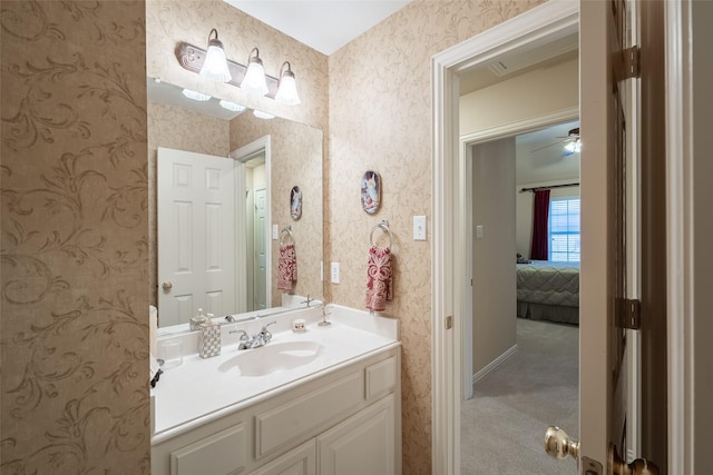 bathroom featuring ceiling fan and vanity