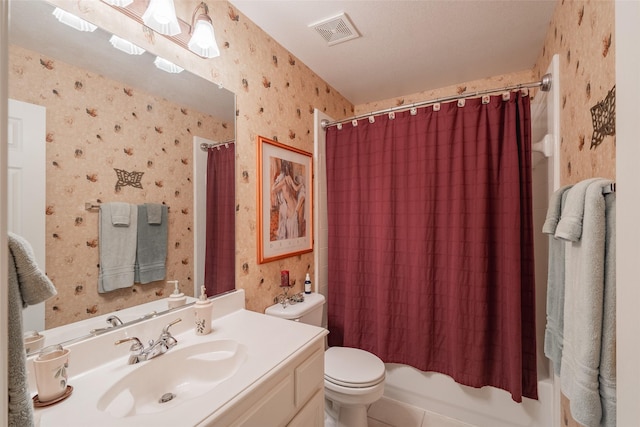 full bathroom with a textured ceiling, tile patterned floors, vanity, toilet, and shower / bath combo with shower curtain