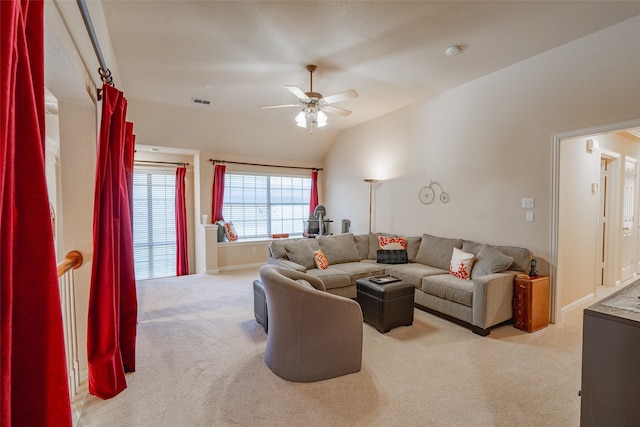 living room with lofted ceiling, light colored carpet, and ceiling fan