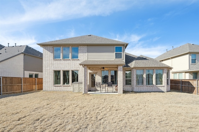 rear view of house featuring a patio and ceiling fan