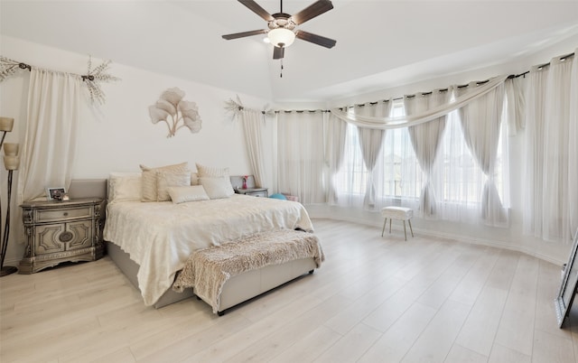 bedroom featuring ceiling fan and light hardwood / wood-style flooring