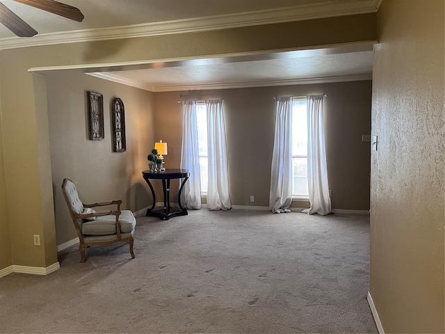 unfurnished room with carpet, ceiling fan, and crown molding