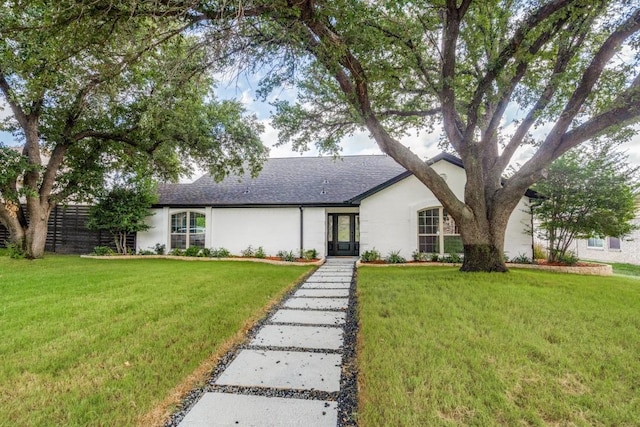 ranch-style house featuring a front lawn