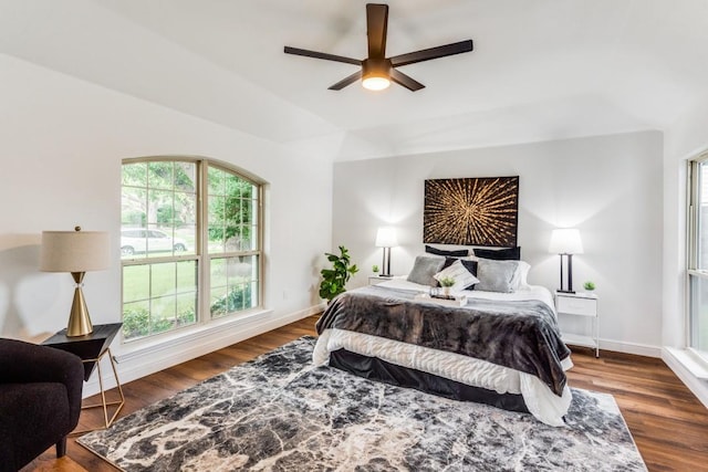 bedroom with ceiling fan and dark hardwood / wood-style floors