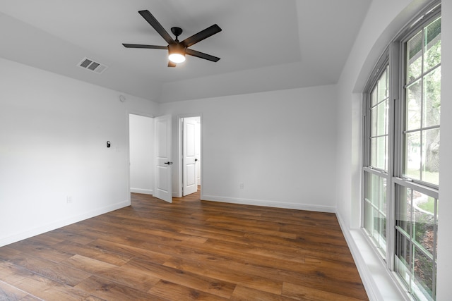 spare room featuring ceiling fan and dark hardwood / wood-style floors