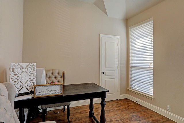 home office with dark hardwood / wood-style flooring