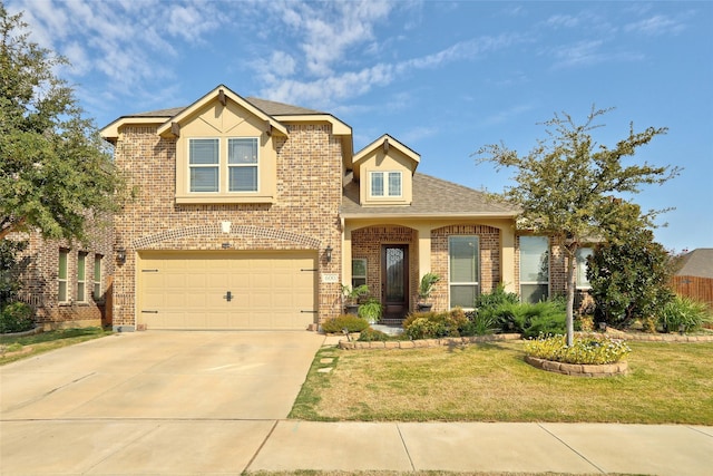 view of front facade with a garage and a front lawn