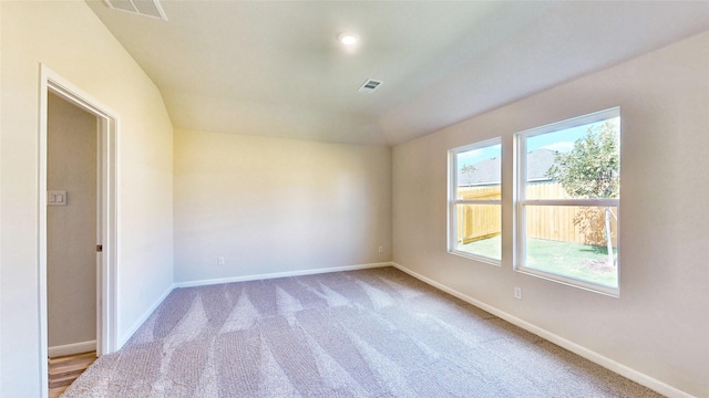 unfurnished room featuring light colored carpet