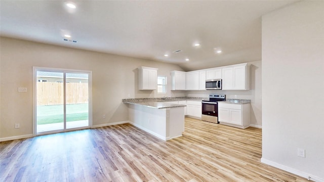 kitchen featuring kitchen peninsula, appliances with stainless steel finishes, white cabinets, light hardwood / wood-style flooring, and sink