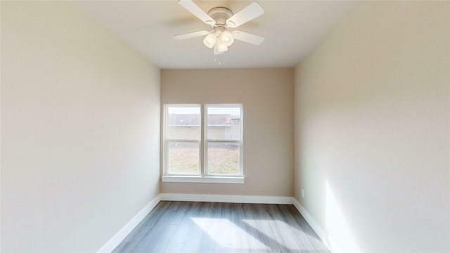 empty room featuring ceiling fan and hardwood / wood-style flooring