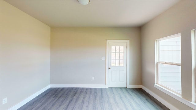 spare room with light hardwood / wood-style floors