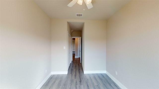 unfurnished room featuring ceiling fan and light wood-type flooring