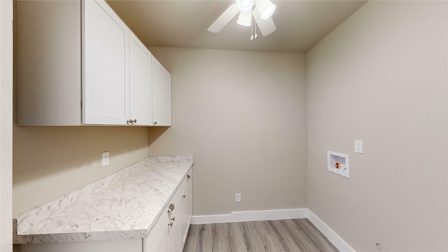 laundry room featuring ceiling fan, cabinets, hookup for a washing machine, and light wood-type flooring