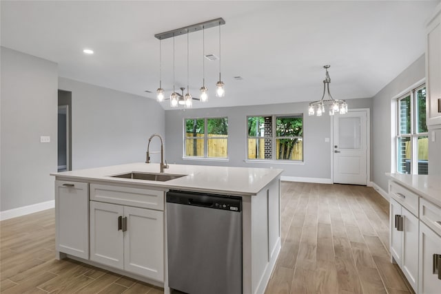 kitchen with white cabinetry, a kitchen island with sink, dishwasher, hanging light fixtures, and sink