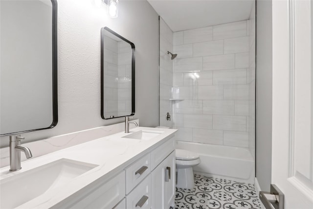 full bathroom featuring toilet, vanity, and tiled shower / bath combo