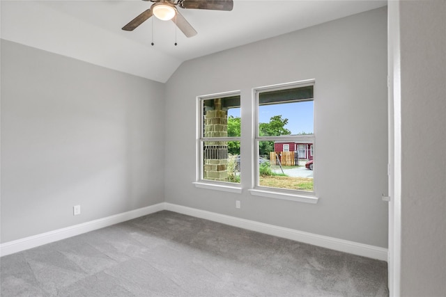 carpeted empty room featuring lofted ceiling and ceiling fan