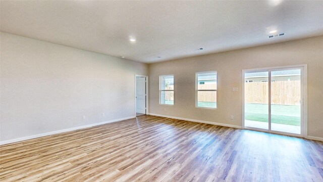 empty room with light wood-type flooring