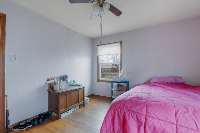 bedroom with ceiling fan and light hardwood / wood-style flooring