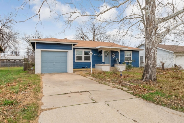 ranch-style house featuring a garage