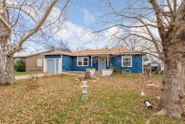 ranch-style house featuring a garage