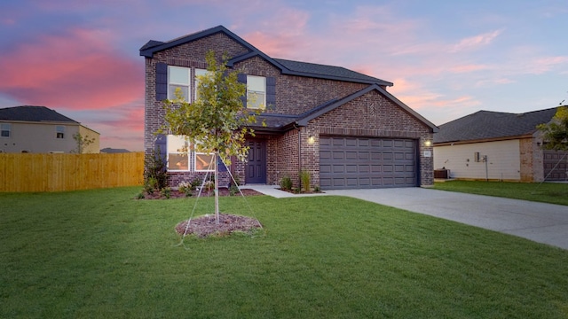 view of front property featuring a garage, cooling unit, and a lawn