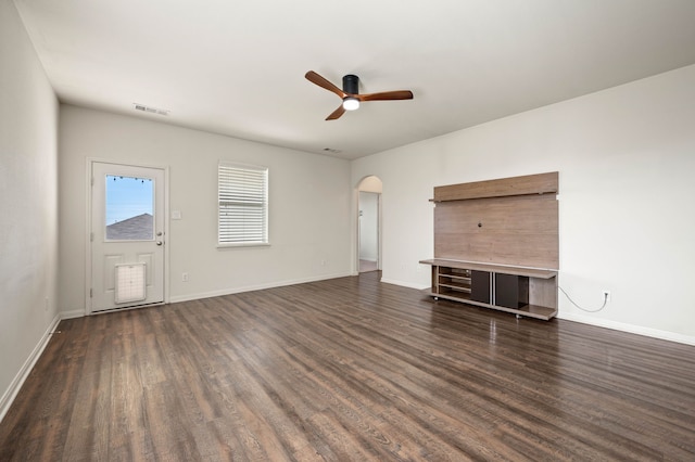 unfurnished living room with ceiling fan and dark hardwood / wood-style floors