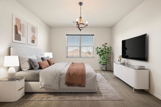 bedroom featuring carpet floors and a notable chandelier