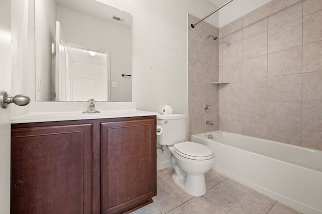 full bathroom with toilet, tiled shower / bath combo, tile patterned floors, and vanity