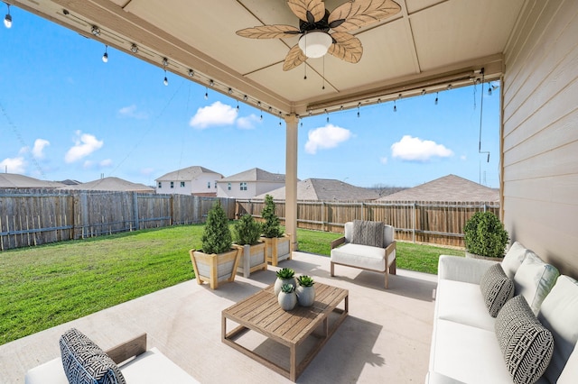 view of patio with ceiling fan and an outdoor living space