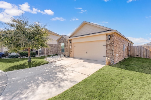 view of front of house with a front yard and a garage