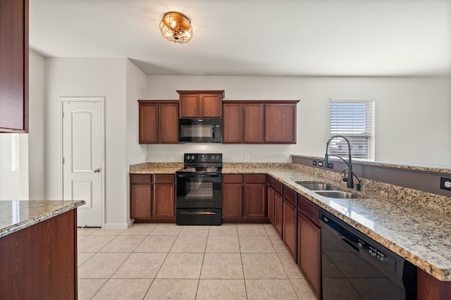 kitchen with black appliances, light tile patterned floors, sink, and light stone counters