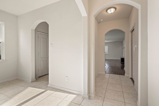 corridor featuring light tile patterned flooring