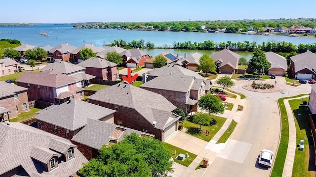 aerial perspective of suburban area with a large body of water