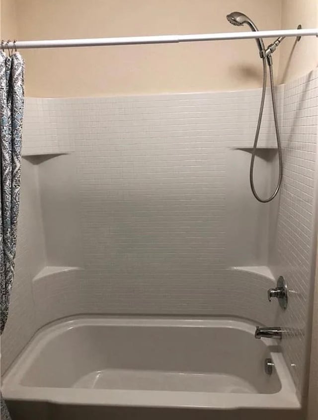 bathroom with shower / tub combination