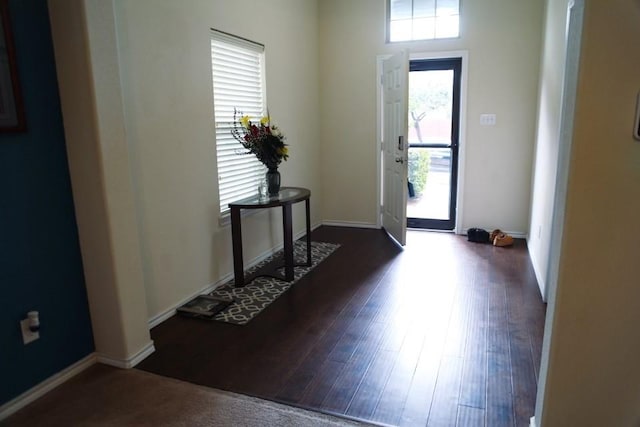 entryway featuring wood finished floors and baseboards