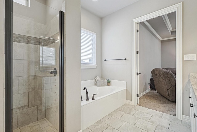 bathroom featuring tile patterned flooring, vanity, crown molding, and plus walk in shower