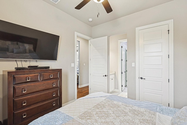 bedroom featuring ceiling fan and ensuite bath