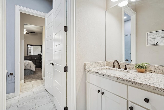 bathroom featuring ceiling fan, tile patterned flooring, and vanity