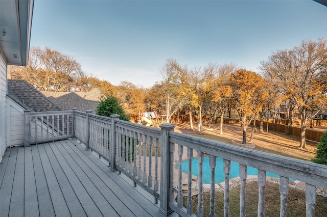 deck with a fenced in pool