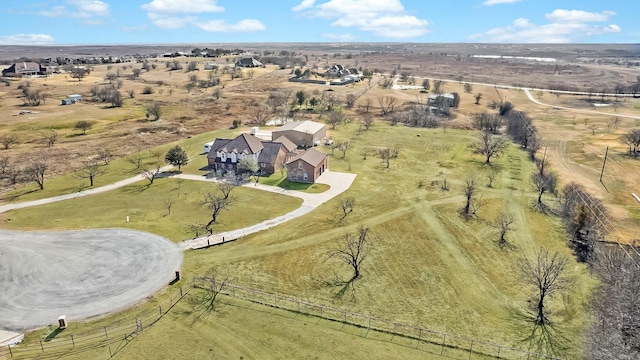 birds eye view of property featuring a rural view