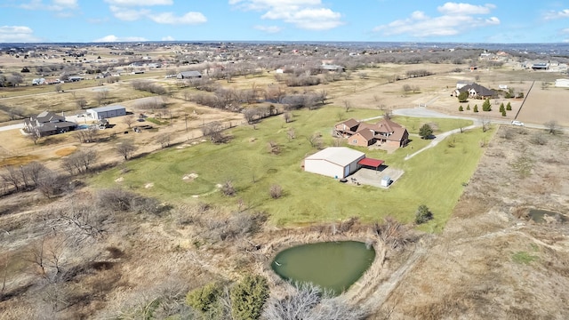 bird's eye view featuring a water view and a rural view