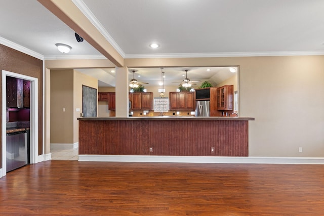 interior space with kitchen peninsula, ceiling fan, light hardwood / wood-style floors, stainless steel appliances, and crown molding