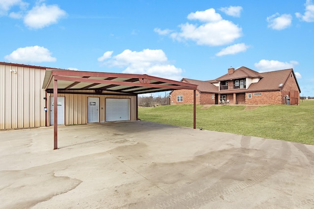 view of patio featuring a carport and a garage